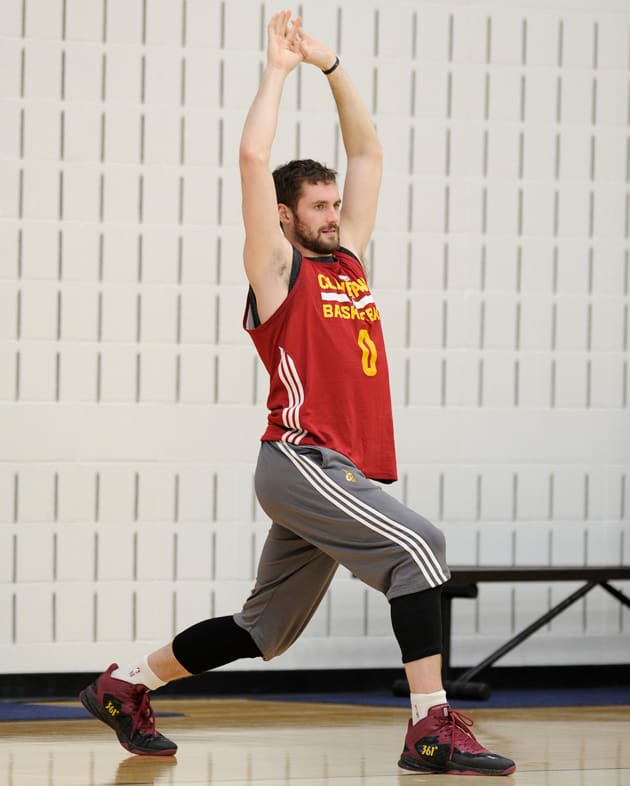 Cleveland Cavaliers forward Kevin Love stretches to loosen up his muscles prior to a team practice.